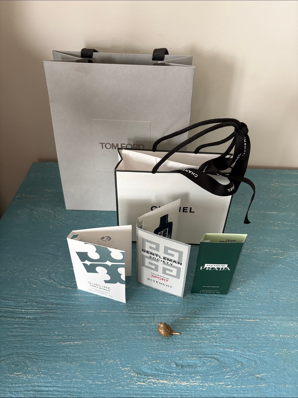 Chanel and Tom Ford shopping bag with perfume samples.